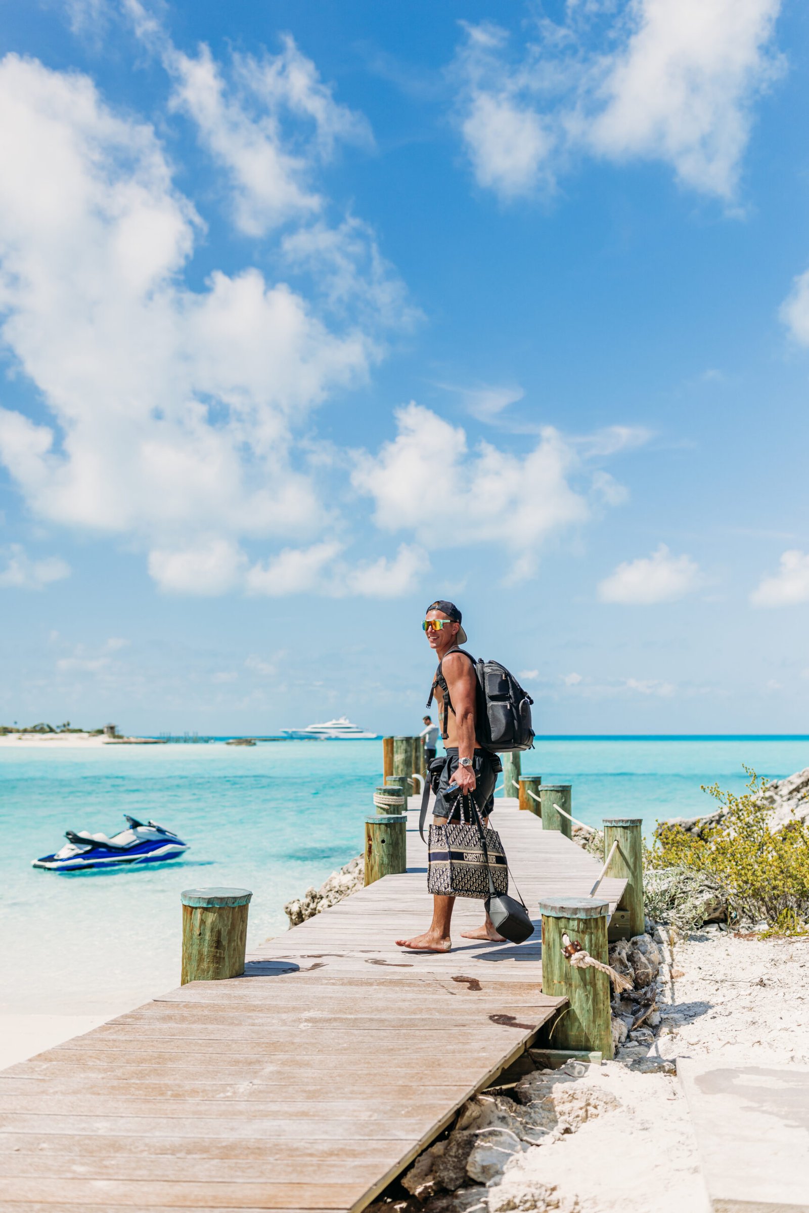Matthew Dowdy walking along a dock at Twin Cays in the Exuma Cays, Bahamas